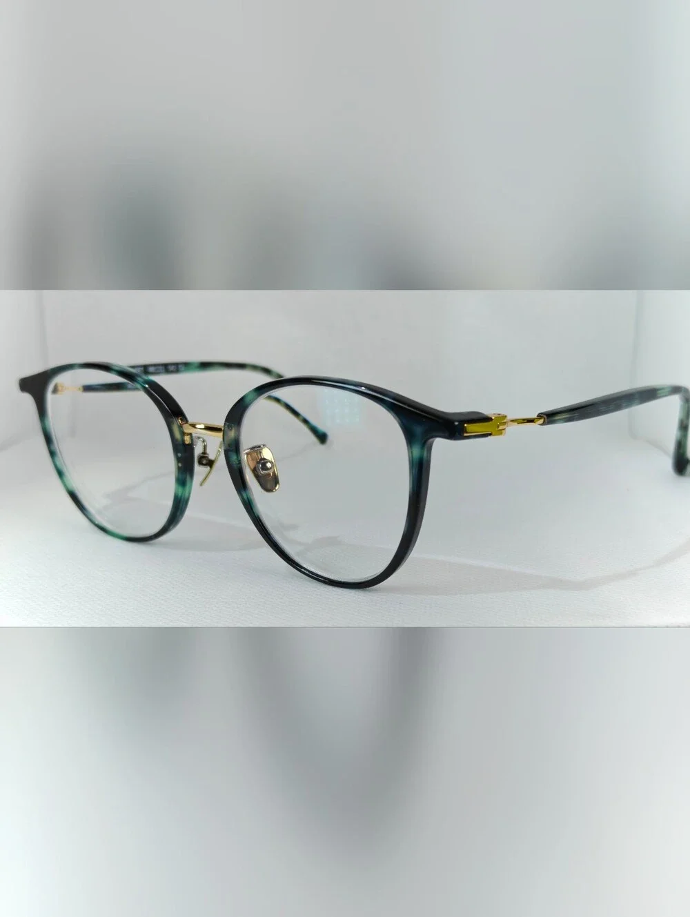 Aloft. Classic Round Women's Eyeglasses in Green Marble Tortoise Gold.